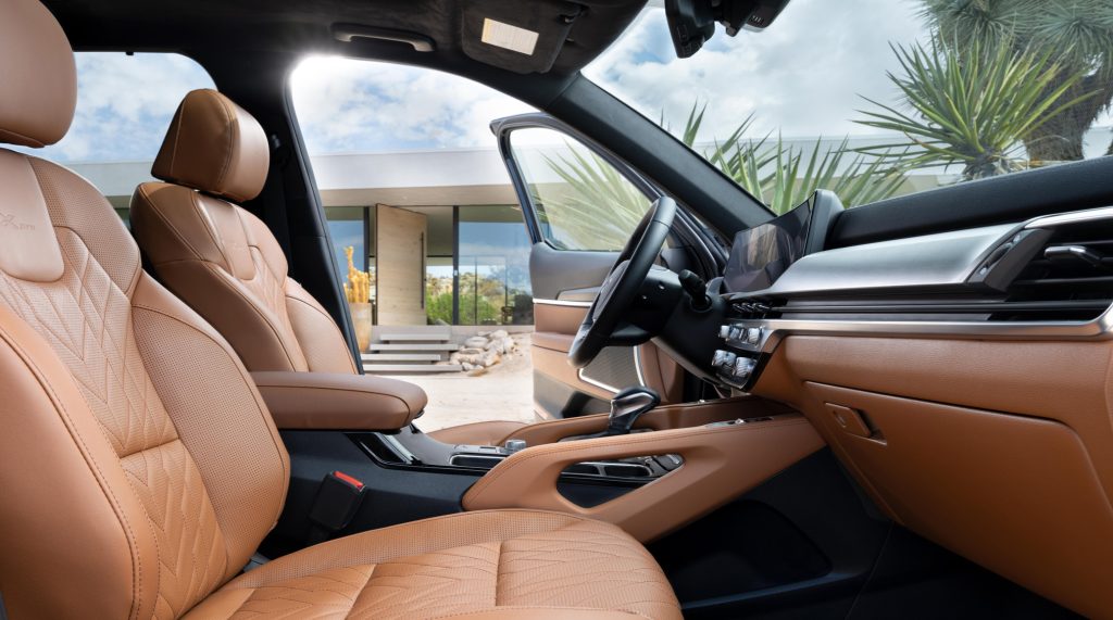 The tan interior of a 2025 Kia Telluride is shown from the drivers side.
