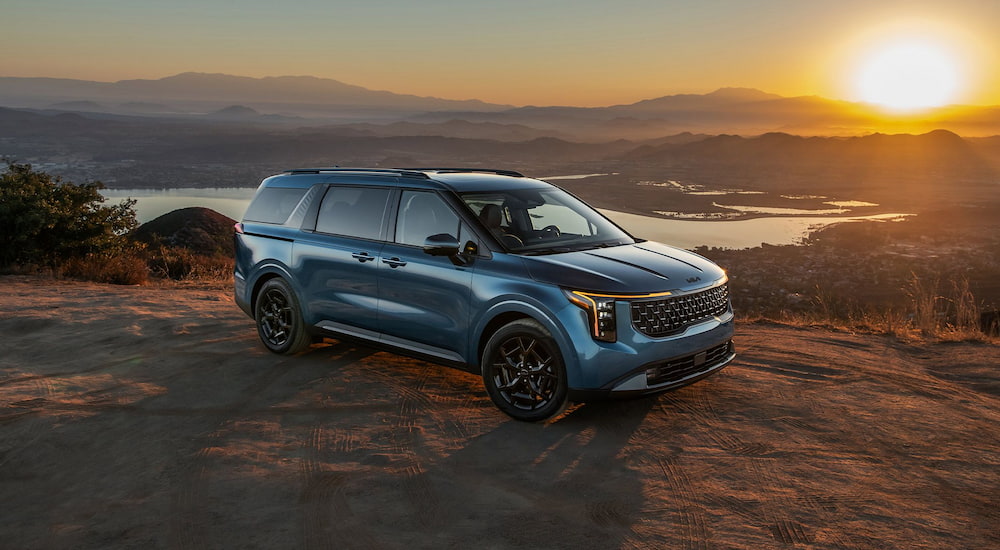 Blue 2026 Kia Carnival parked off-road after visiting Kia dealer near St. Cloud.