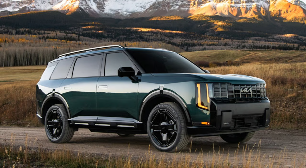 Green 2026 Kia Telluride driving off-road